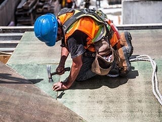 health-and-safety-training-dublin-man-wearing-hard-hat-on-roof